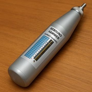 A rebound hammer used for testing concrete strength.