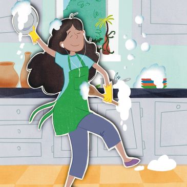 A woman happily washing dishes with soap bubbles around her in the kitchen.