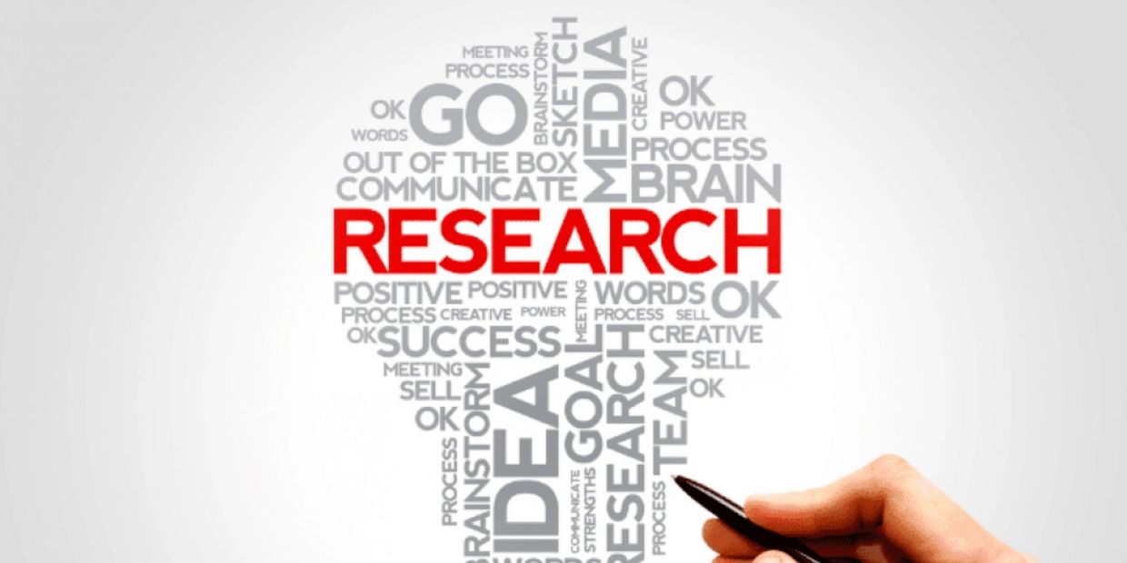Word cloud shaped like a light bulb with "RESEARCH" highlighted in red.
