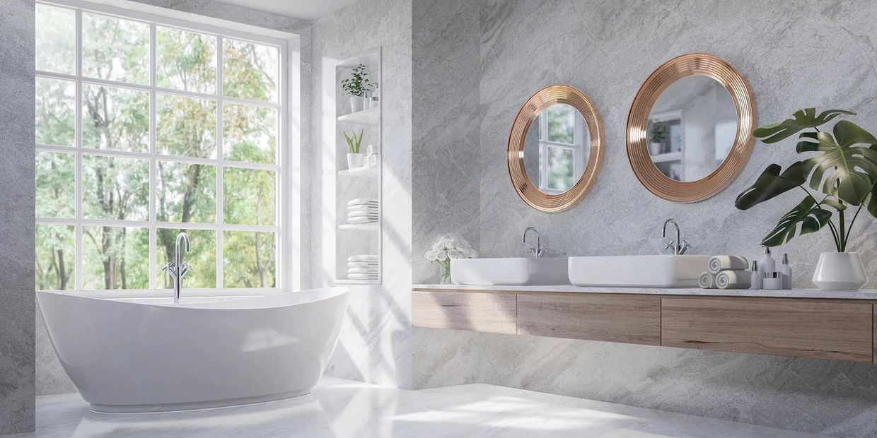 Bright modern bathroom with a large window, freestanding tub, and double sinks with round mirrors.