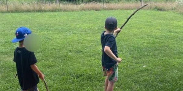 Children doing archery in Durham Region, ON as part of adventure and outdoor camp. Whitby.