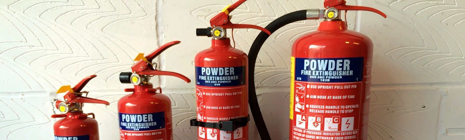 Red fire extinguishers on floor.