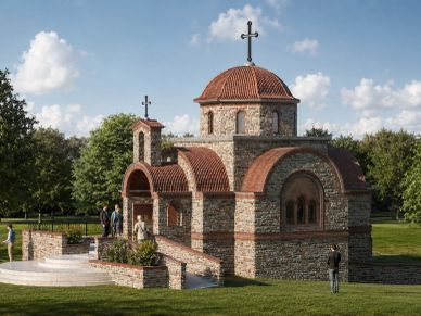 Small stone and brick church with arched windows, red tile roofs, and crosses in a landscaped park.