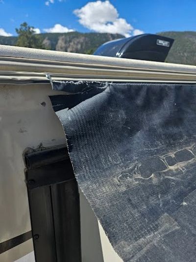 Slide topper awning is torn and needed repair at Rocky Top RV, Green Mountain Falls, CO