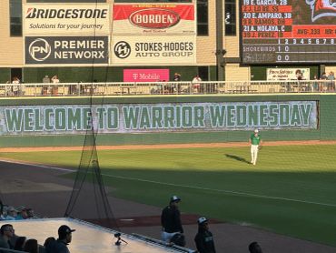 Welcome to Warrior Wednesday banner at the stadium.