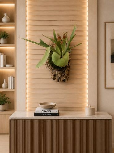 Modern interior with a mounted plant, books, and soft lighting.
