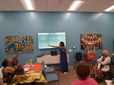 Dr. Sonya Conley, educating a group of seniors on financial literacy and the importance of proper estate planning.  