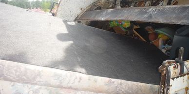 Sofa inside our Garbage truck part of our Junk Removal Couch Removal Service