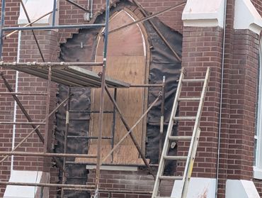 The first step in this build was to remove the stained glass window for reinstallation in the new ad