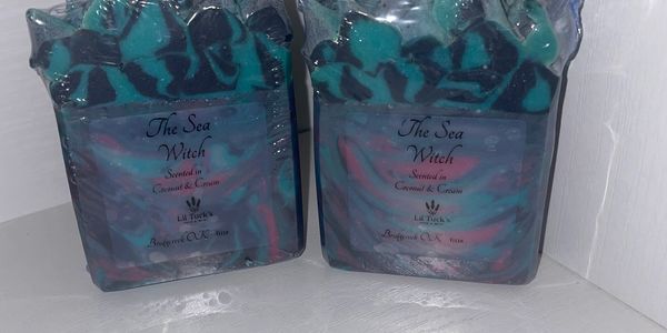 Two colorful, artisanal soaps named 'The Sea Witch' wrapped in plastic.