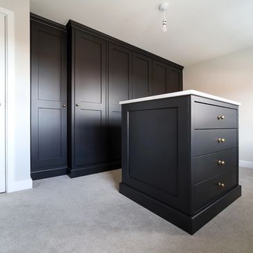 Black shaker Dressing room with island.