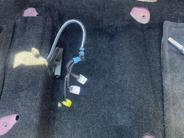 Picture of floor underneath the drivers seat on a customers Prius 