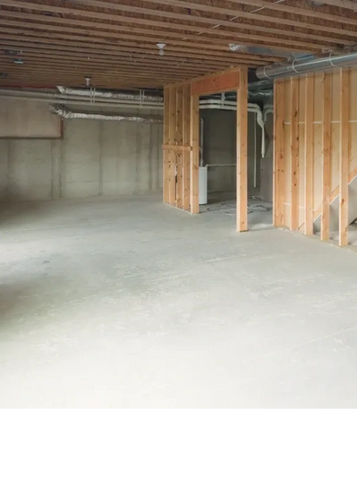 Newly poured basement slab, prepped for rough framing. 