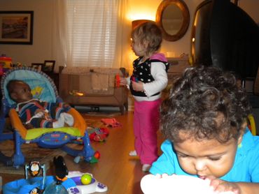 Pic 16.
Baby and two toddlers in a room hanging out together at daycare.