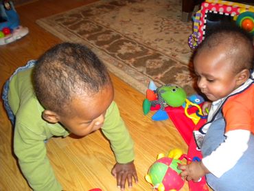 Pic 14
Two toddlers playing on the floor.