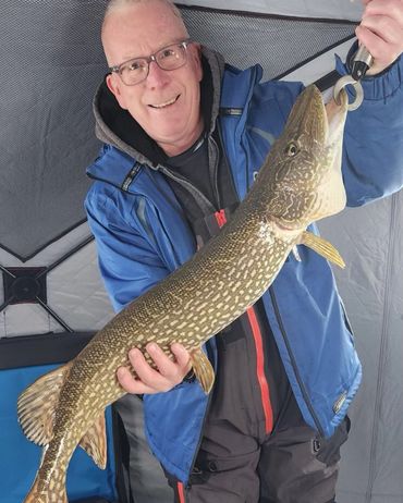 Ice fishing for big Northern Pike on a live minnow.