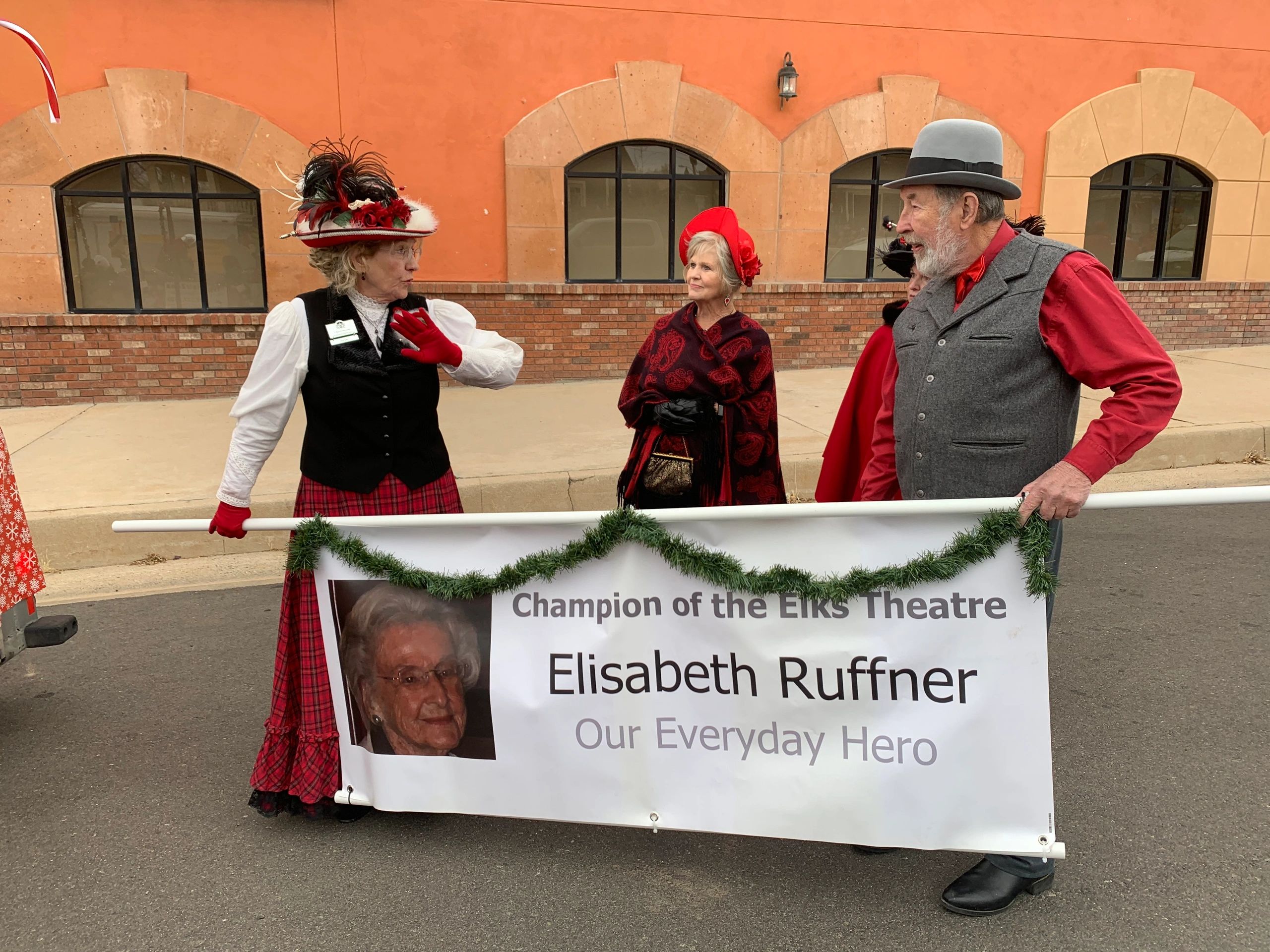 Banner walkers at 2022 chrustmas Parade to hounour Elizab eth Ruffner