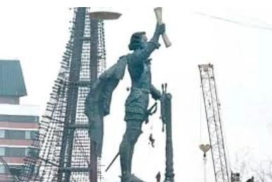Statue with arm raised