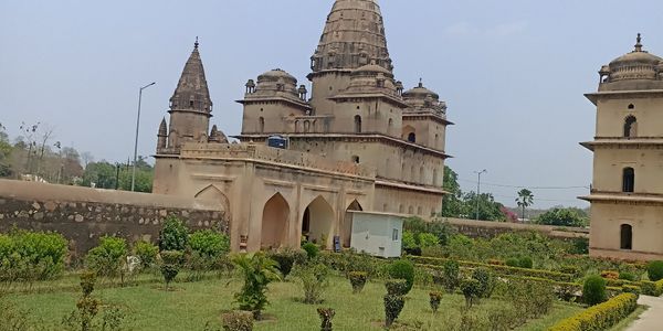 Historic Indian palace with intricate architecture and lush gardens.