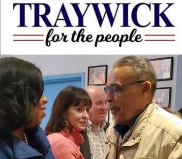 People engage in conversation at a Traywick campaign event.