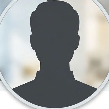Generic silhouette profile icon on blurred background.
