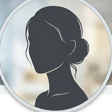 Silhouette of a woman with hair in a bun against a blurred background.