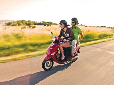 Couple riding Genuine Scooter Vivie Scooters Bismarck, ND