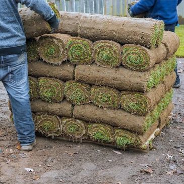 Pallet of sod delivered to customers address and being installed. 