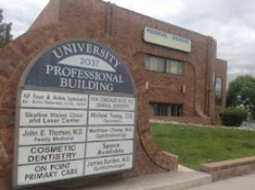 University Professional Building sign listing medical specialists and services.