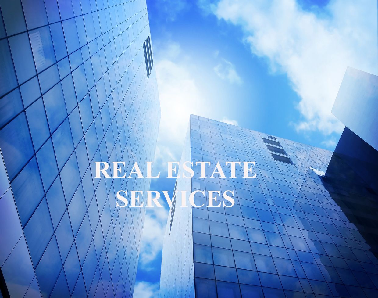 The side of glass windowed tall building