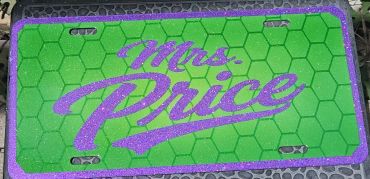 Green license plate with purple glitter text "Mrs. Price."