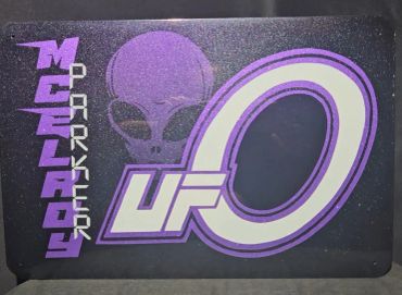 Logo design featuring a UFO and the name McElroy Parker.