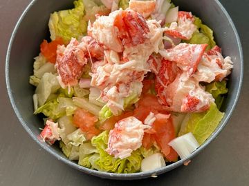 House Salad - Romain lettuce, tomatoes, onion topped with Cooked Maine Lobster Salad.