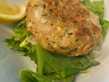 Our Crabcakes are served in house, and/or available to purchase and take home.  We air fry to serve.