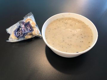 New England Clam Chowder, eat in or take home as a cold pint.