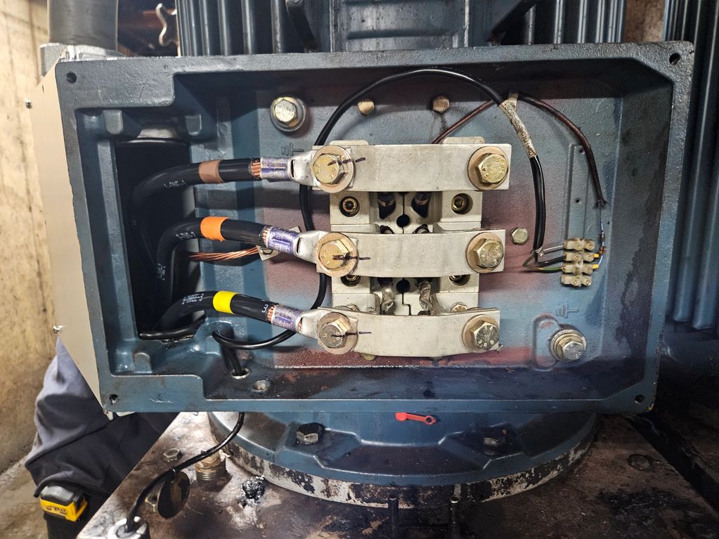 Close-up of an electrical panel with connected wires and terminals.