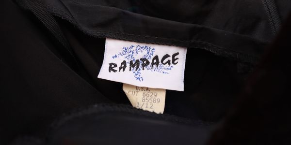Clothing label with the brand name Rampage on a black garment.