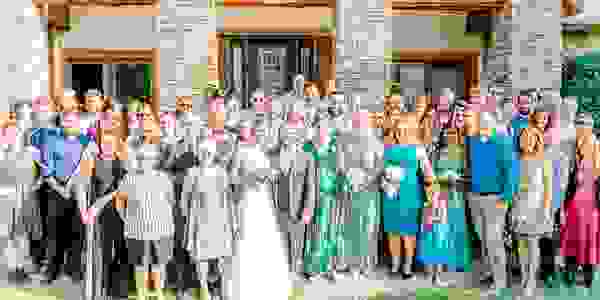 Large gathering of people standing in front of The Lodge