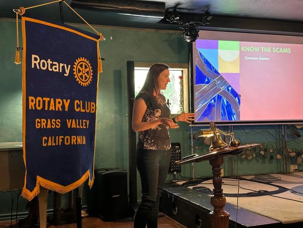 Woman giving a presentation at Rotary Club in Grass Valley, California.