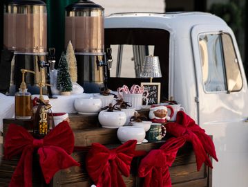 Festive truck bed decorated with red bows, candy canes, and snowflakes for Christmas.