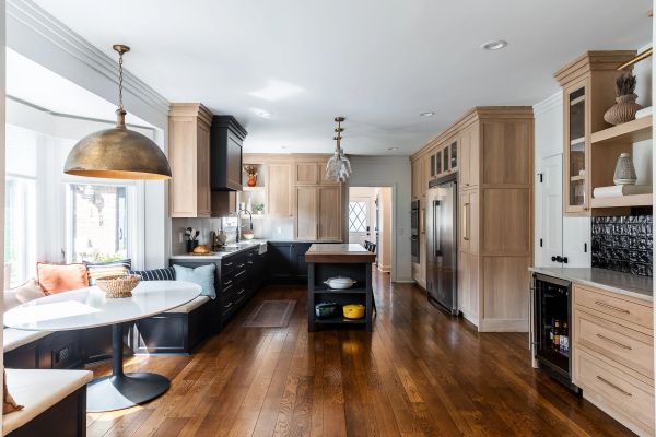 Spacious modern kitchen with wood cabinets and island.