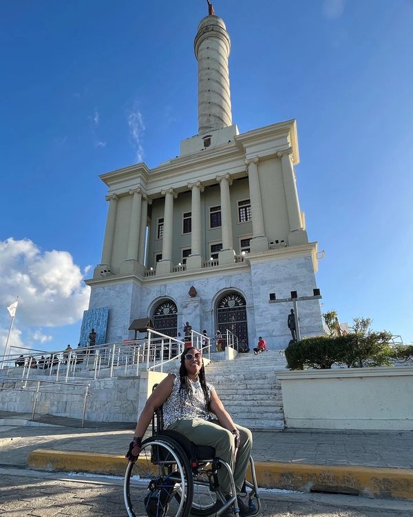 Johileny in wheelchair in front of Dominican Republic Monument. 