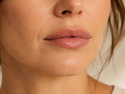 Close-up of woman's lips and lower face.