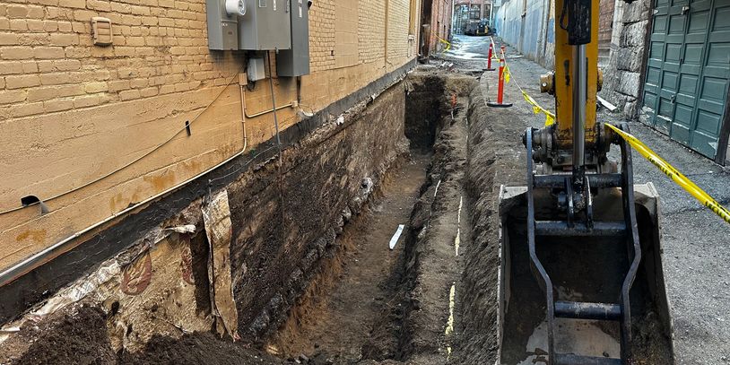 Freshly dug trench near a residential home for utility or foundation excavation in Helena, MT