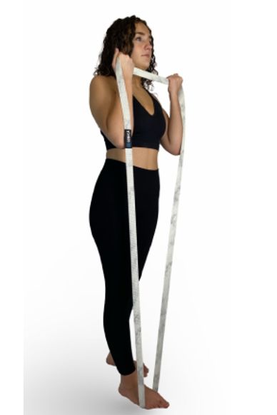 Girl doing standing bicep curl with long band