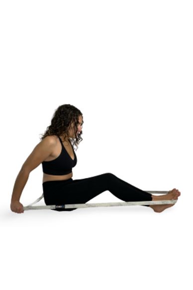 Girl doing tricep kickback with long band