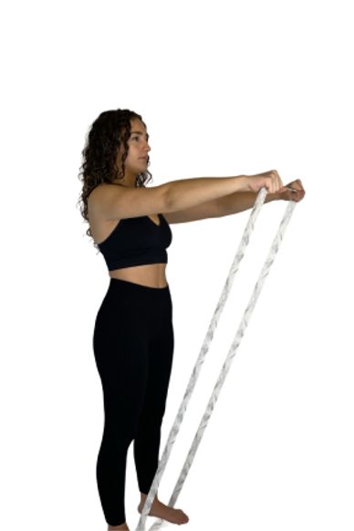 Girl doing arm raises with long band