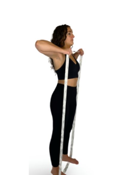 Girl performing a high pull with a long band