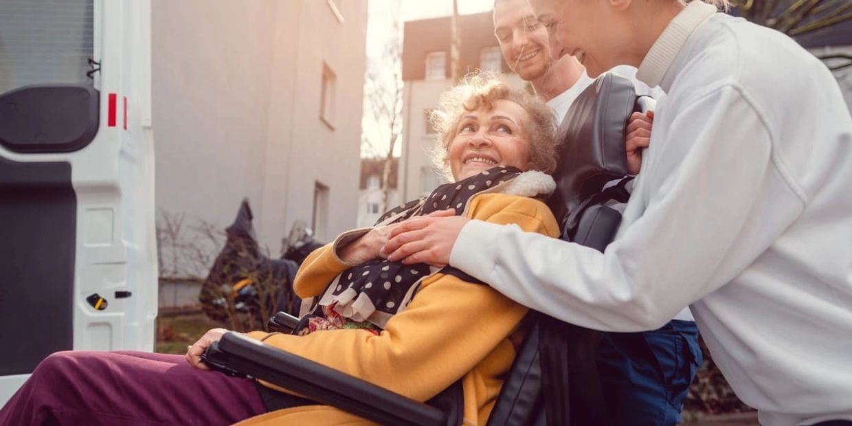 Home Care worker looking after a patient and helping with Transport services