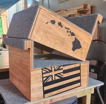 Wooden box decorated with Hawaiian flag and map of Hawaii.